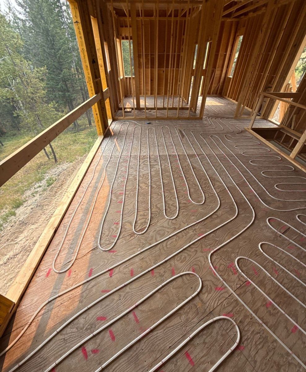 Radiant tubing laid in loops over the subfloor before the topping slab